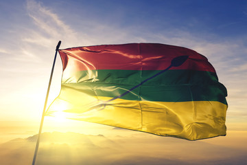 Neiva of Colombia flag waving on the top sunrise mist fog