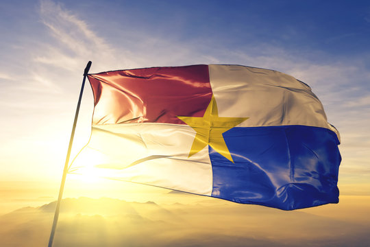 Monteria of Colombia flag waving on the top sunrise mist fog