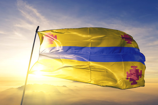 Popayan of Colombia flag waving on the top sunrise mist fog