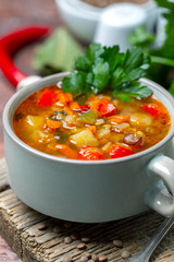 Homemade lentil soup with vegetables close-up.