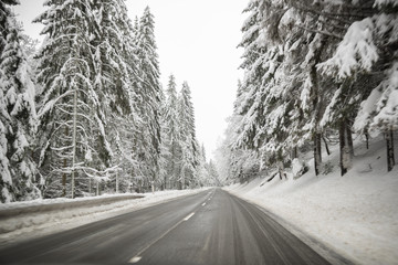 icy cold dangerous  freezing driving conditions on a road  in a winter