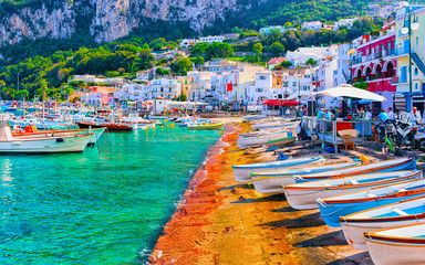 Boats at Marina Grande embankment in Capri Island Tyrrhenian sea reflex