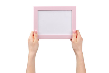 Female hands holding photo frame with copy space isolated on white