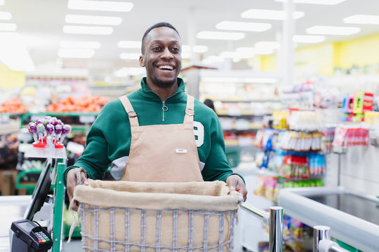 Portrait smiling confident male grocer working in supermarket
