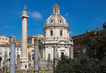 Fototapeta na wymiar Trajan's Column and The Church of the Most Holy Name of Mary at the Trajan Forum, Rome, Italy.