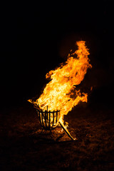 Real fire flames in fireplace. Outdoor fireplace.