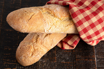 Loaves of Fresh French Baguette on a Rustic Wooden Table