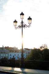 evening sun shining at the Bridge of Triana, seville
