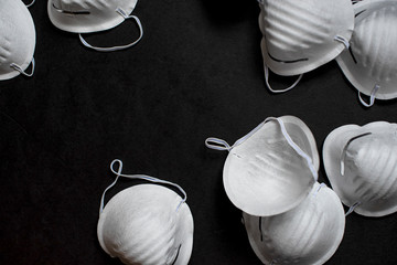 Many face masks on black background