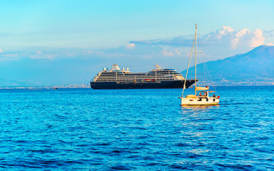 Obraz premium Cruise ship and boat at Marina Grande port in Sorrento reflex