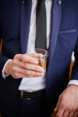 Man holds a glass in his hand