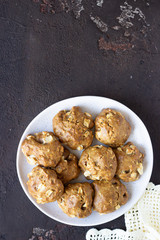 Soft and tender apple biscuits on a ceramic plate, dark concrete background. Dessert or breakfast for children, sweet snack. Selective focus.