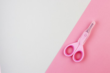 small pink closed scissors for baby care