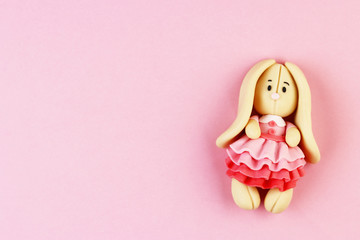 Plasticine Easter Bunny on a pink background
