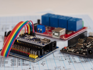 Arduino and programmers with peripherals and expansion boards lie on a gray background. do it yourself.Arduino micro.Arduino macro.
