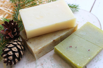 Natural handmade soap on a wooden background. Spa-natural treatments.Natural organic soap from scratch with pine aroma, essential oils.