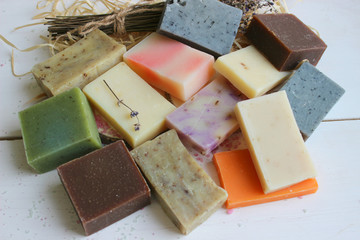 Colorful handmade soap concept. Natural handmade soap on a wooden background.Handmade natural eco soap, selective focus. Copy of the space, top view, background mode. Healthy skin. Wash their hands.