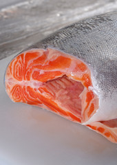 .juicy salmon lies on a white board
