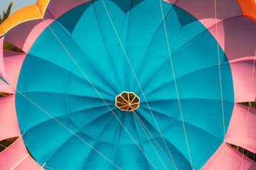 Close Multi-colored Parachute For Parasailing On Background Of Blue Sky