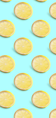 Seamless pattern of lemon slices on blue background. Food texture
