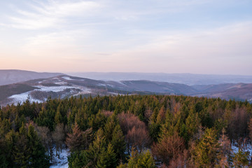 it will be early in the morning in the mountains at sunrise with fog