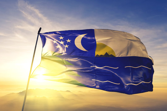 Paita of Peru flag waving on the top sunrise mist fog