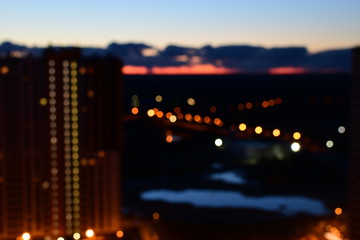 Fototapeta na wymiar Blurred midnight city backgound., view from window.
