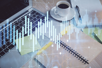 Multi exposure of forex graph drawing and desktop with coffee and items on table background. Concept of financial market trading