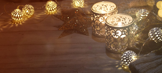 Cosy and soft winter background, knitted sweater and lights