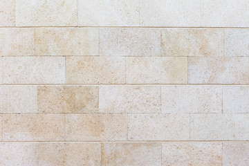 Texture of white stone. Accurate masonry of white sandstone. Brick wall.