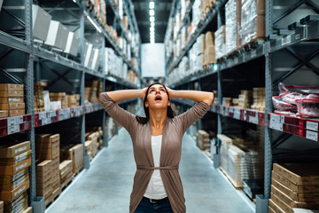 Woman looking lost,in shock.Buying in hardware store.Arts and crafts shopping.Hoby store.Home renovation.Interior designer.Handmade creative do it yourself project supplies.Refurbishing.Makeover idea.