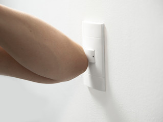 elbow turning on and off the power switch