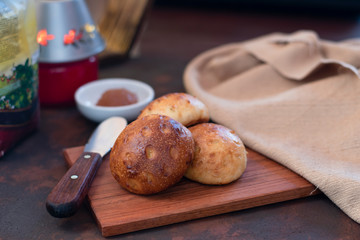 Homemade bread on wooden board with jam background