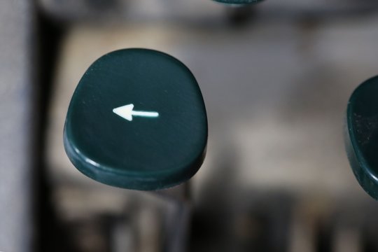 Vintage typewriter backpspaceor arrow key