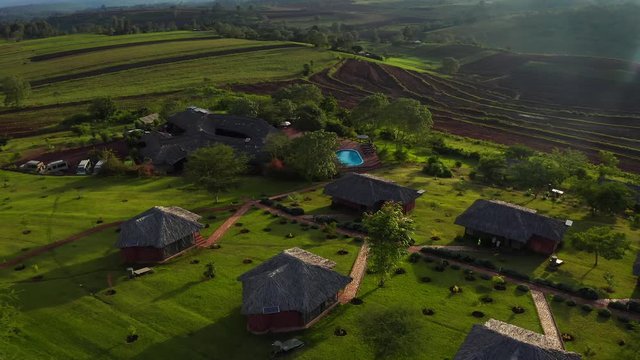 Aerial View Of The Cosy Eco Lodge Located In Tanzania In The Middle Of National Park Near Kilimanjaro Volcano.