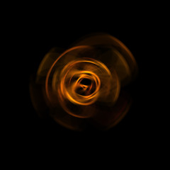 Spinning rays of light isolated on black background. Graphic 2D illustration of glowing colorful light particles in circular motion.