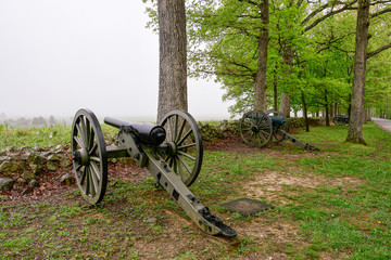 Fototapeta na wymiar Canon in field on foggy morning, Gettysburg, Pennsylvania.