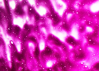Pink background created by soap foam during a car wash