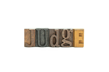 Judge in wood block letters