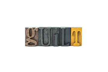 guilt in wood block letters