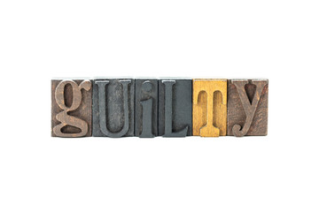 Guilty in wood block letters