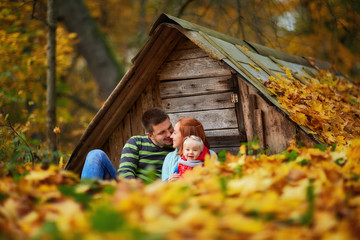 happy family in the autumn forest