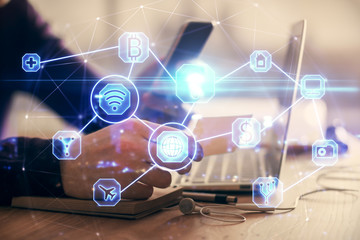 Double exposure of man's hands holding and using a phone and social network theme drawing.