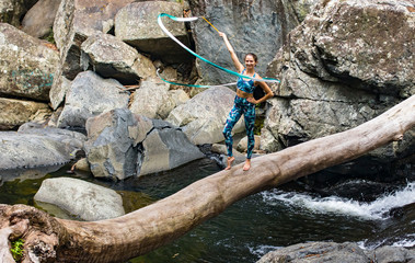 Rhythmic gymnastics ribbon practice on the log
