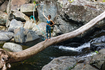 Rhythmic gymnastics ribbon practice on the log