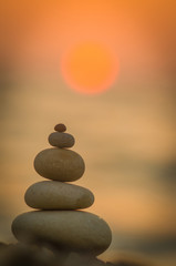 stack of zen stones on pebble beach