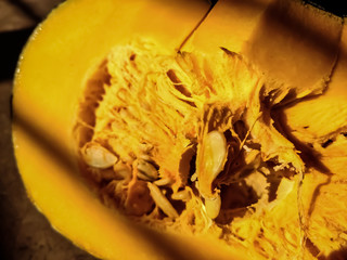 A pumpkin is a cultivar of winter squash that is round with smooth, slightly ribbed skin, and most often deep yellow to orange in coloration.