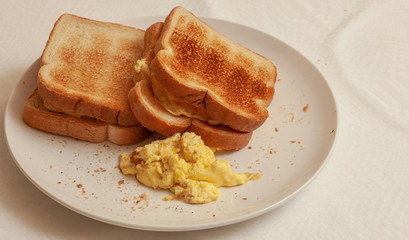 Delicious breakfast served with toast sendwich and eggs.