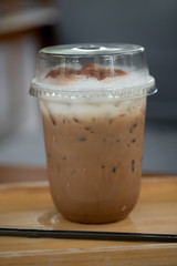 Iced coffee mocha in clear plastic glass