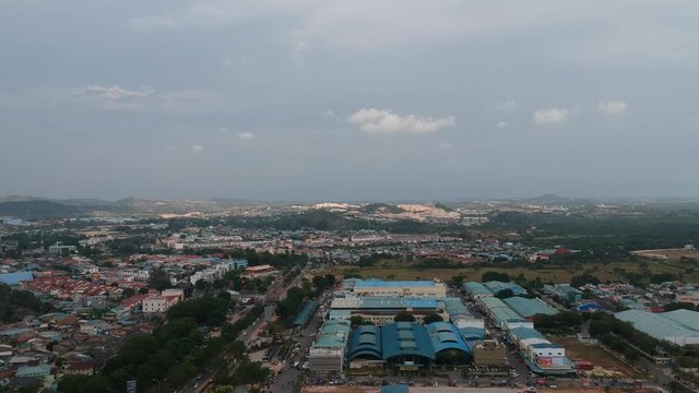 Aerial shot of batam city in afternoon,cloudy.In the background is a shopping mall building complex.batam island,indonesia